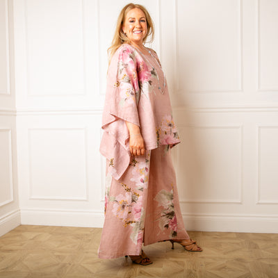The dusky pink Bouquet Print Linen Trousers with a wide stretchy elasticated waistband for extra comfort 