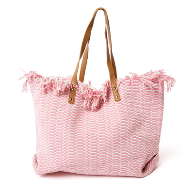 The Woven Beach Bag in pink with a fun aztec and striped pattern, perfect for summer